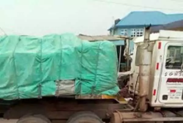 Horror! Truck Crushes Woman To Death After Her Cloth Got Hooked To The Vehicle In Ikorodu (Graphic Photos)